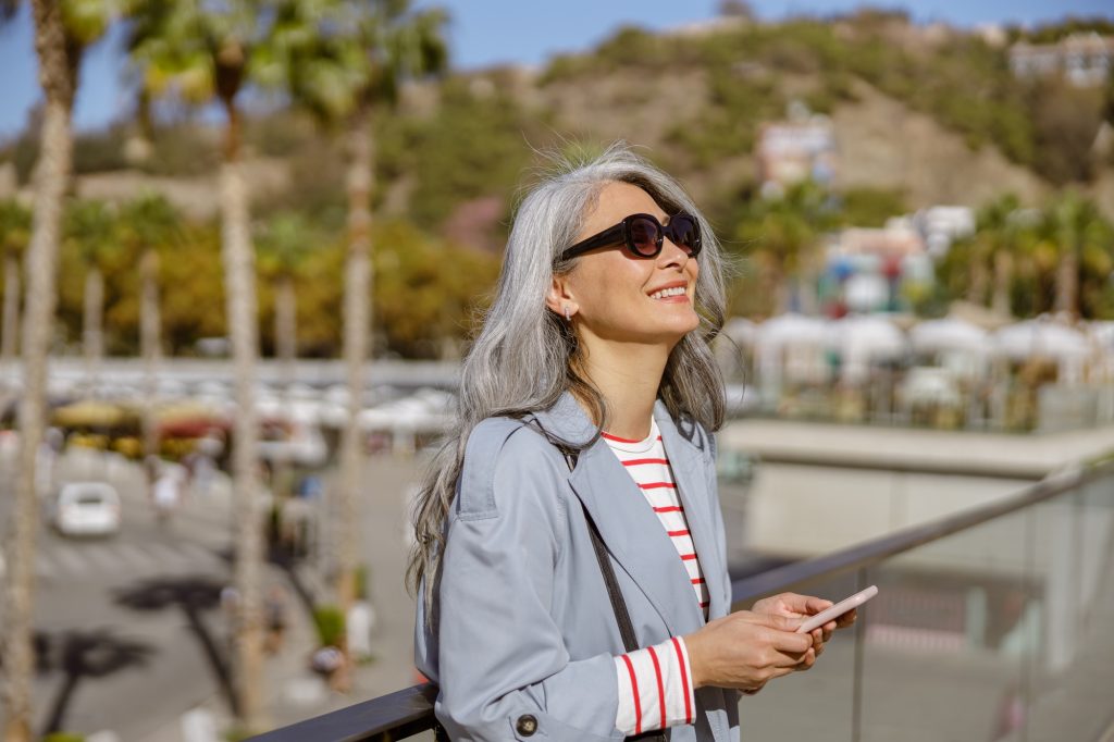Happy and healthy woman enjoying good day outdoors